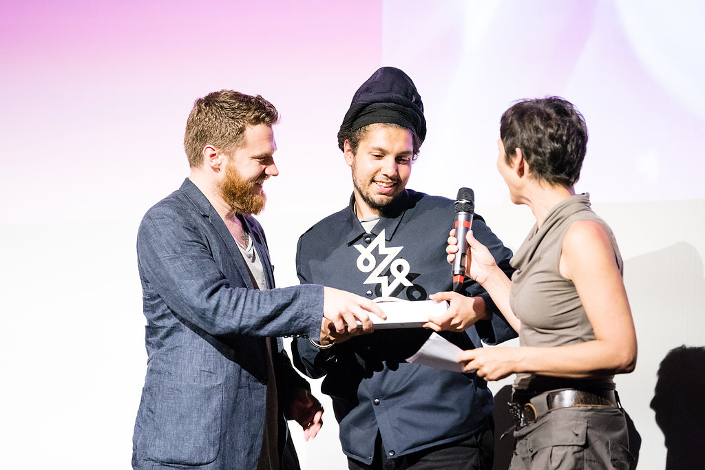 Filmmaker receiving his award at the Mobile Motion Film Festival